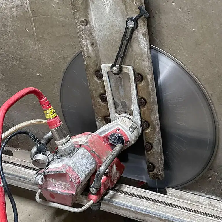 Track sawing concrete cutting Track saw cutting concrete on a fixed rail